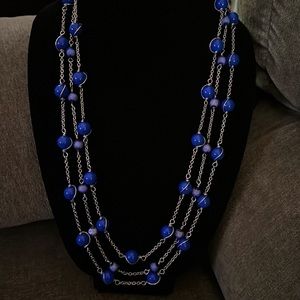 Vintage multi strand necklace with rich blue accents.